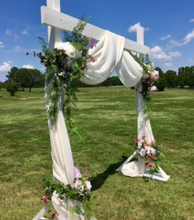 white wooden wedding arch 