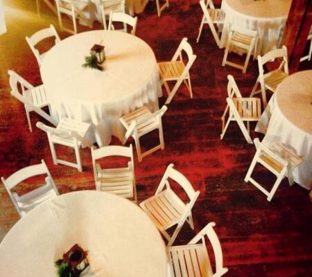 view from above of white tables and chairs at wedding reception