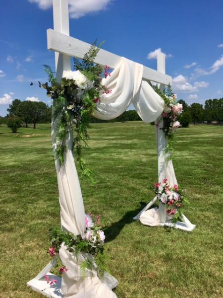 white wooden wedding arch 